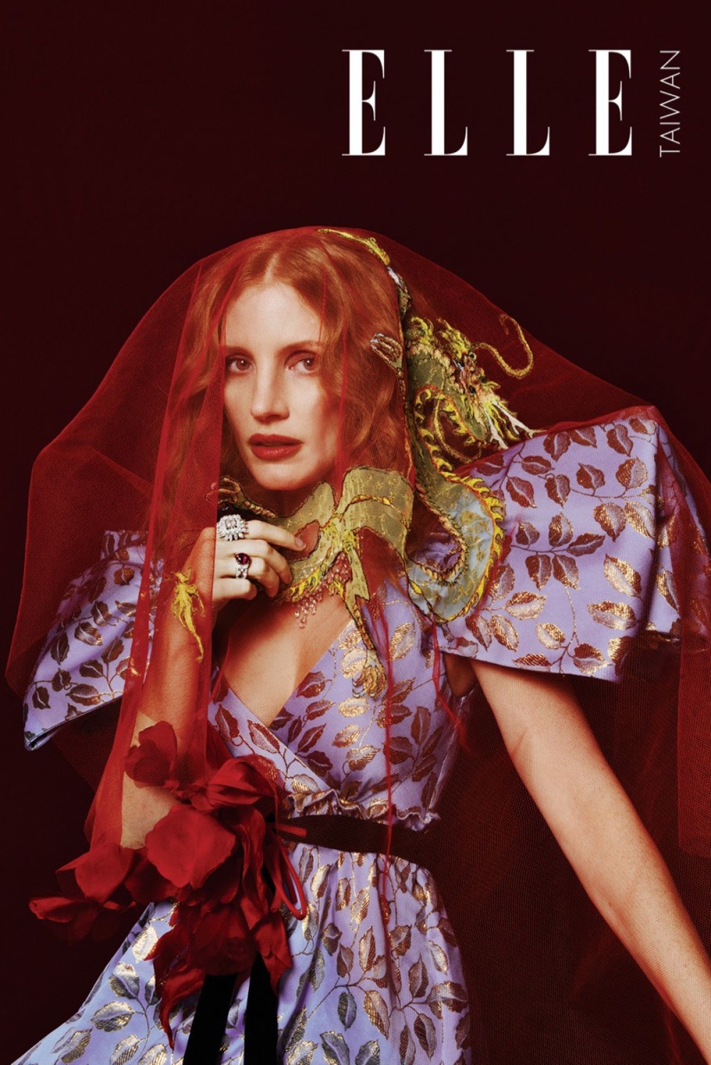 Covered in red veil, Jessica Chastain wears Gucci gown