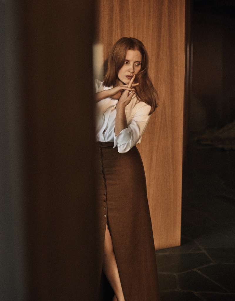 Jessica Chastain poses in Max Mara shirt and New York and Brock Collection skirt