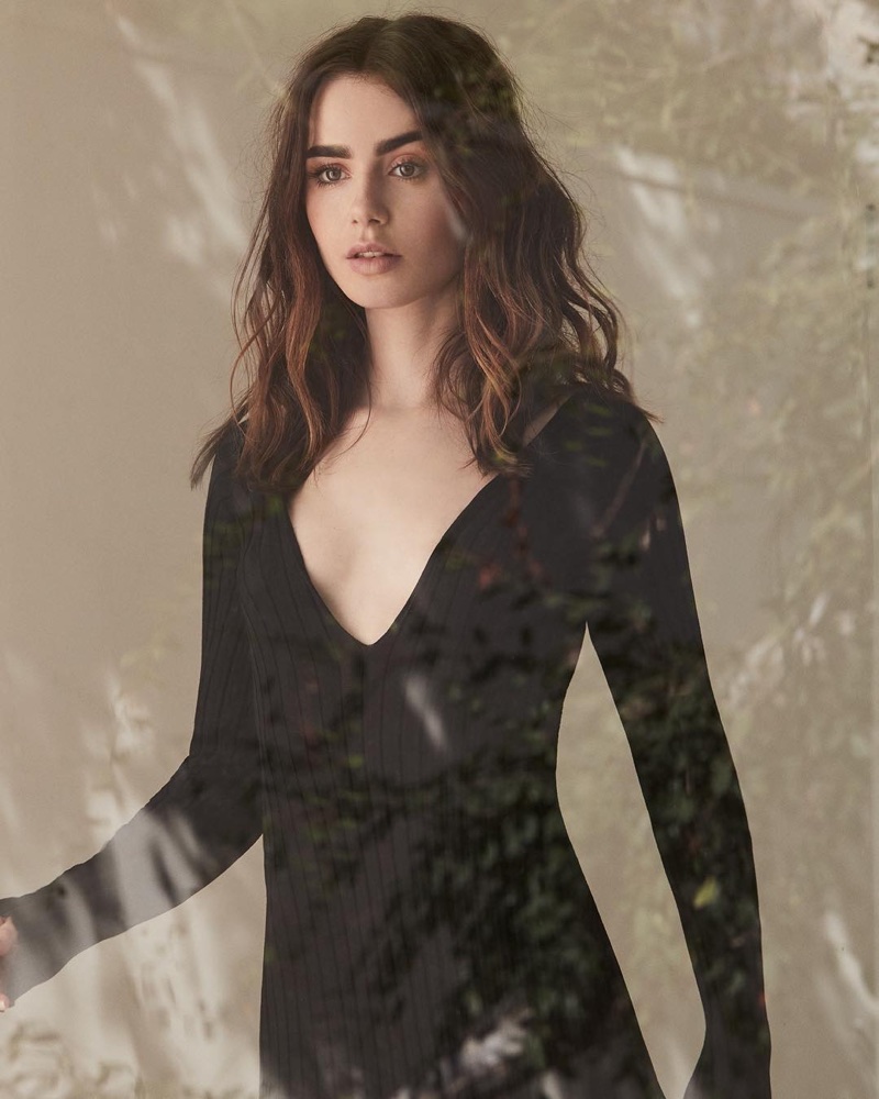 Wearing a little black dress, Lily Collins poses in design from The Line