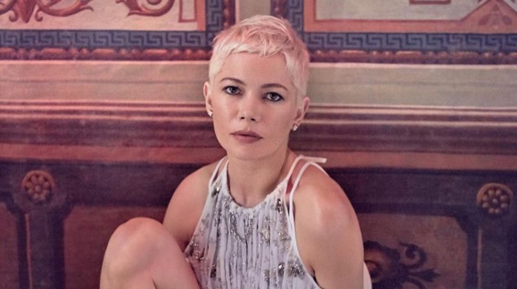 Posing barefoot, Michelle Williams wears a Louis Vuitton dress