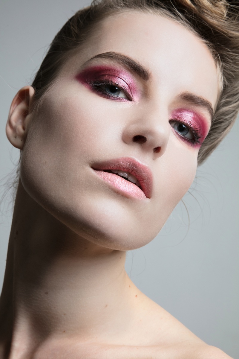 Model Noah Steenbruggen tries on shimmering pink eyeshadow. Photo: Jeff Tse