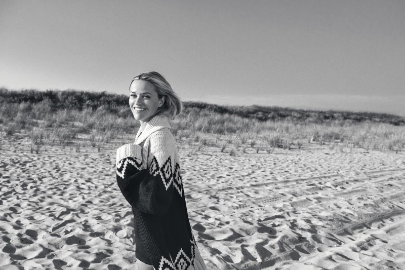 Posing at the beach, Reese Witherspoon wears Marc Jacobs sweater