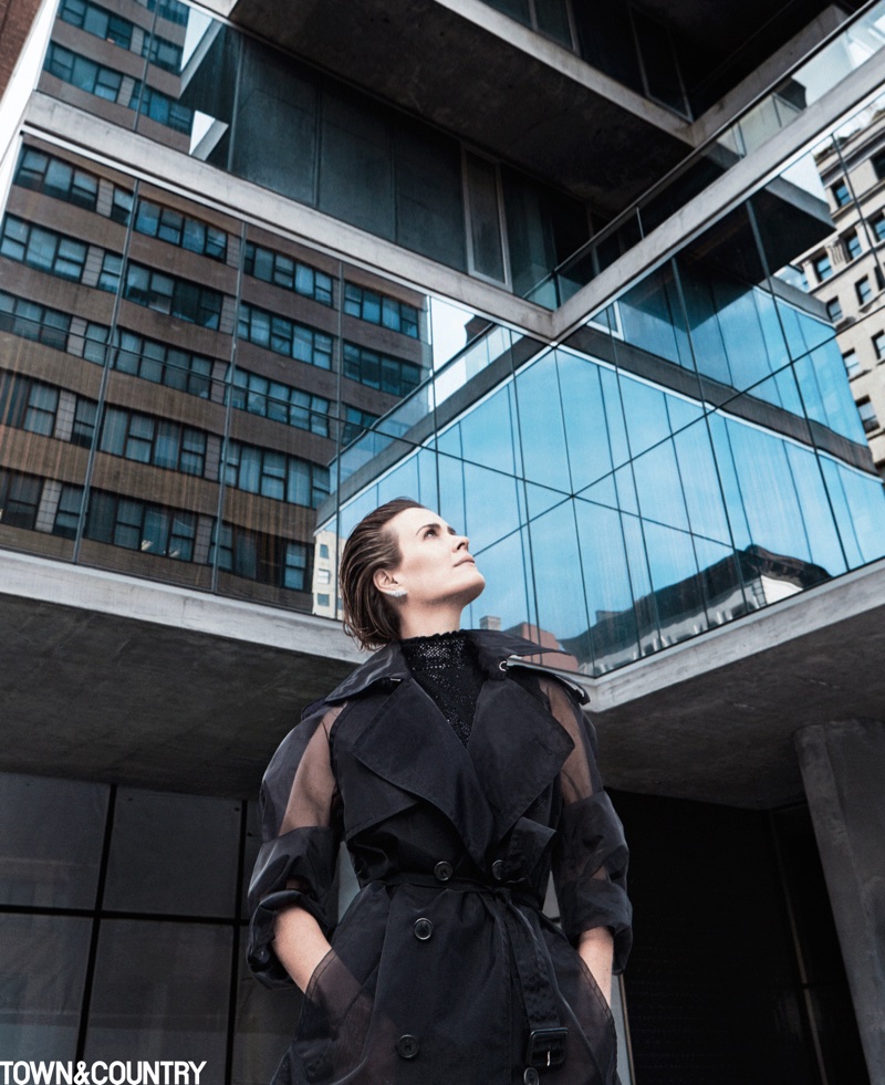 Actress Sarah Paulson poses in Maison Margiela trench coat, Giorgio Armani dress and Yeprem earrings