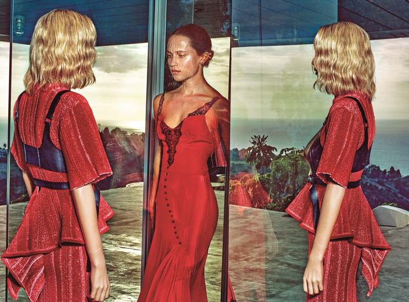 Actress Alicia Vikander poses in red Olivier Theyskens dress