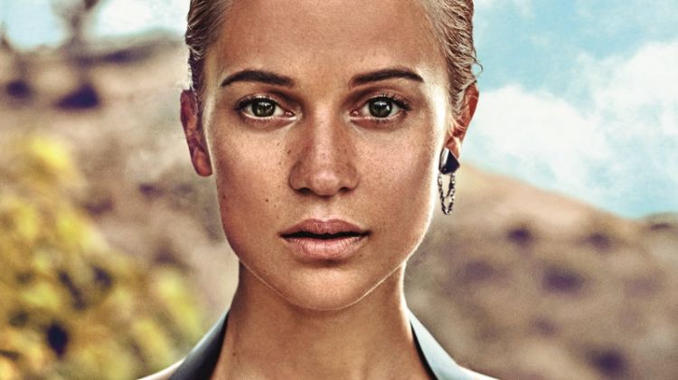 Ready for her closeup, Alicia Vikander wears Louis Vuitton blouse, dress and earring