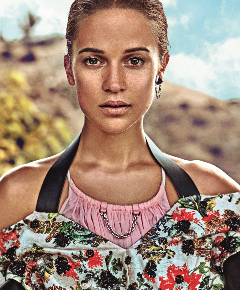 Ready for her closeup, Alicia Vikander wears Louis Vuitton blouse, dress and earring