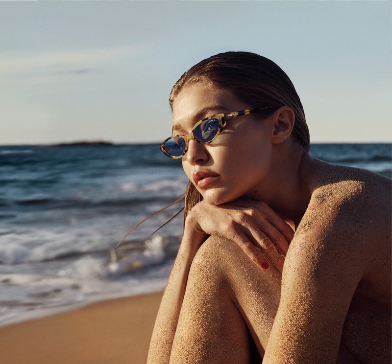 Gigi Hadid poses at the beach in Vogue Eyewear collaboration