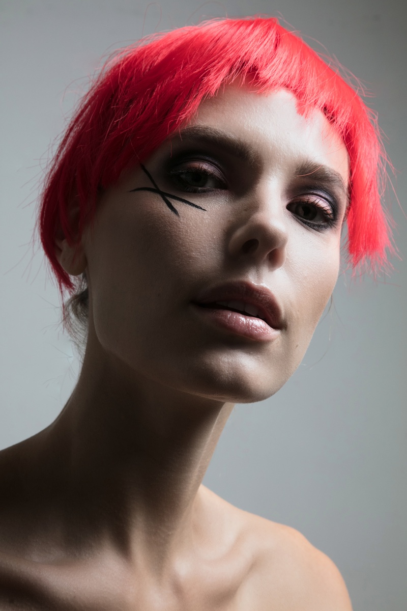 Jenny Savers poses with cropped red hairstyle. Photo: Jeff Tse