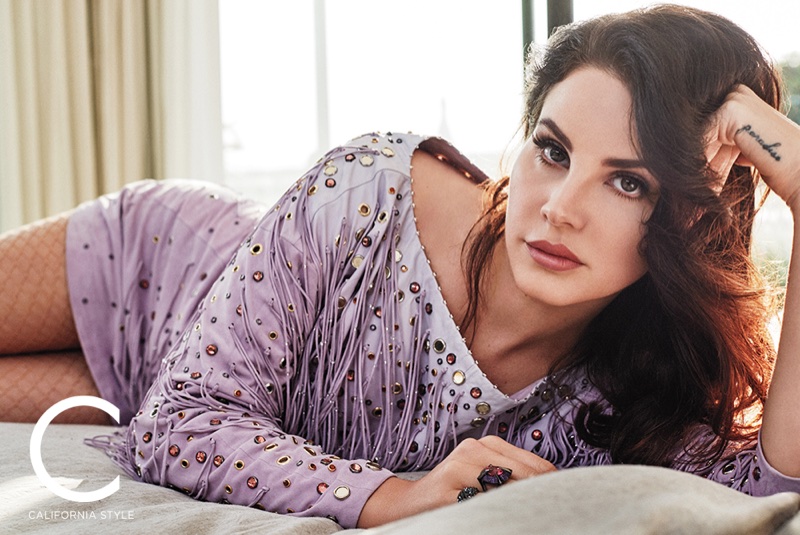 Posing in bed, Lana Del Rey wears Bottega Veneta dress