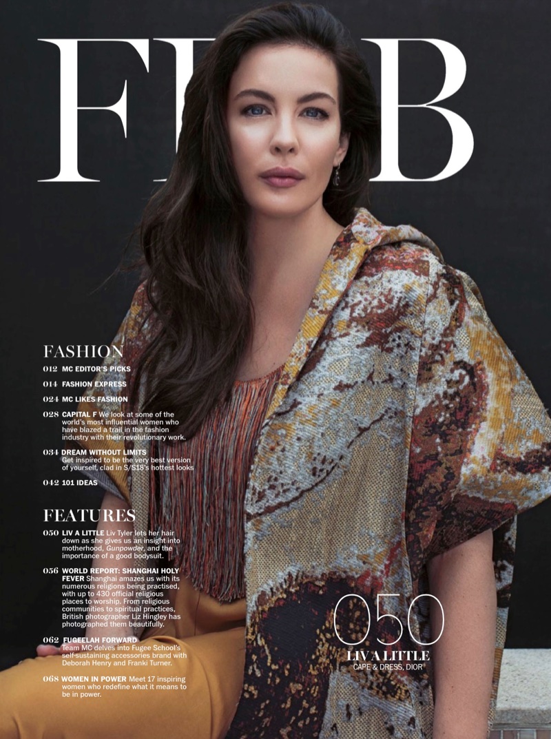 Actress Liv Tyler poses in Dior cape and dress