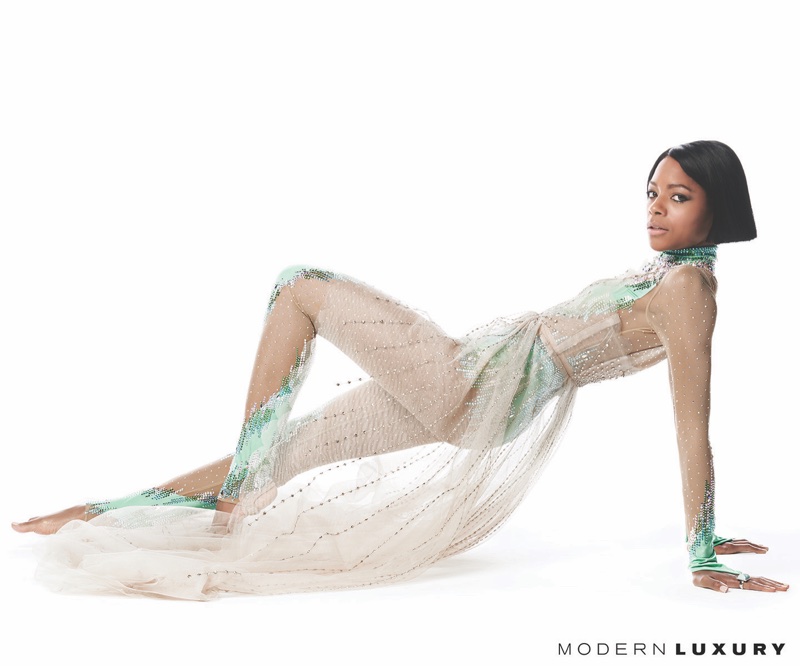 Striking a pose, Naomie Harris wears Gucci soft tulle gown and embroidered jumpsuit