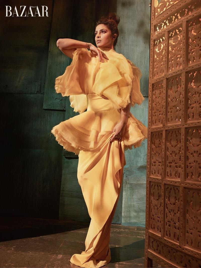 Actress Priyanka Chopra poses in yellow gown