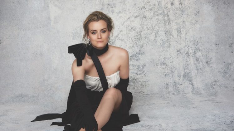 Taylor Schilling wears Marc Jacobs strapless dress and Gloves with David Webb earrings