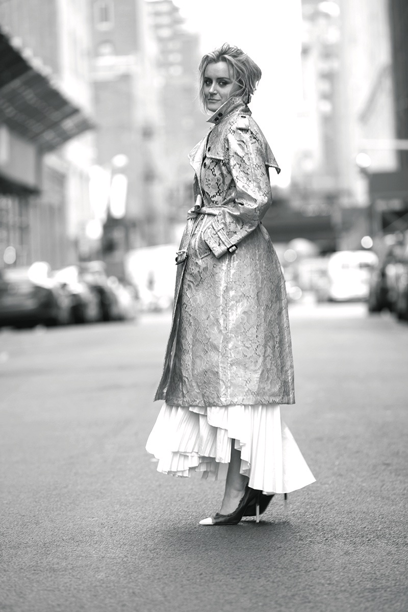 Taylor Schilling poses in Burberry lace trench coat, Tom Ford pumps and top with Brunello Cucinelli skirt