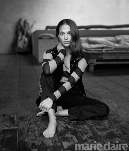 Alicia Vikander Stars in Marie Claire, Talks 'Tomb Raider' Alicia Vikander poses in Louis Vuitton vest, top, pants and earrings