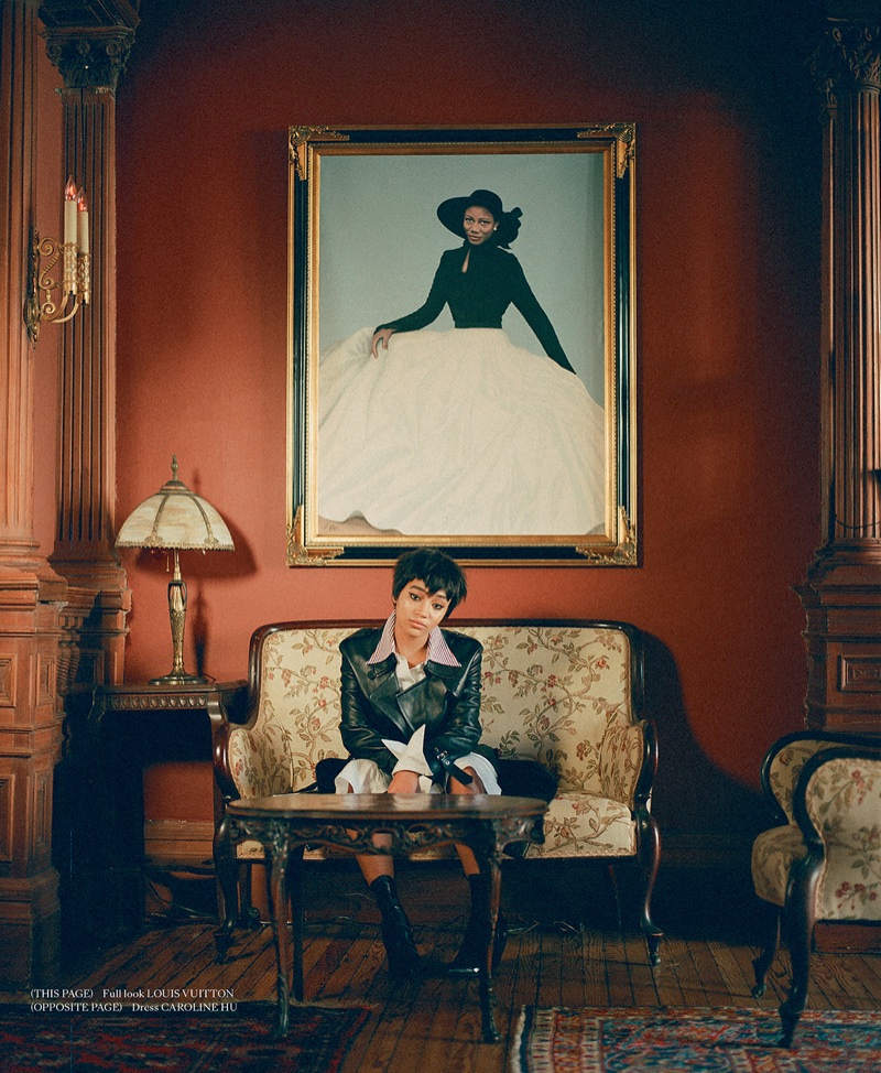 Posing on a couch, Amandla Stenberg wears Louis Vuitton ensemble