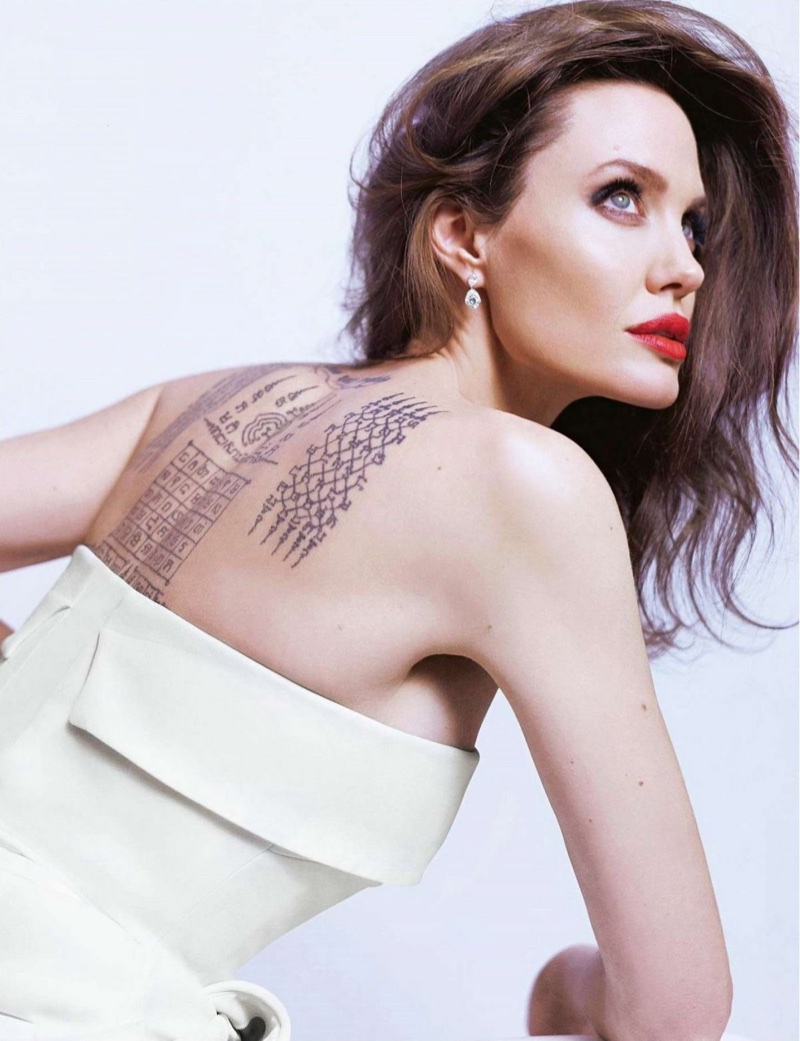 Actress Angelina Jolie shows off her back tattoo for Guerlain. Photo: Mathieu Cesar