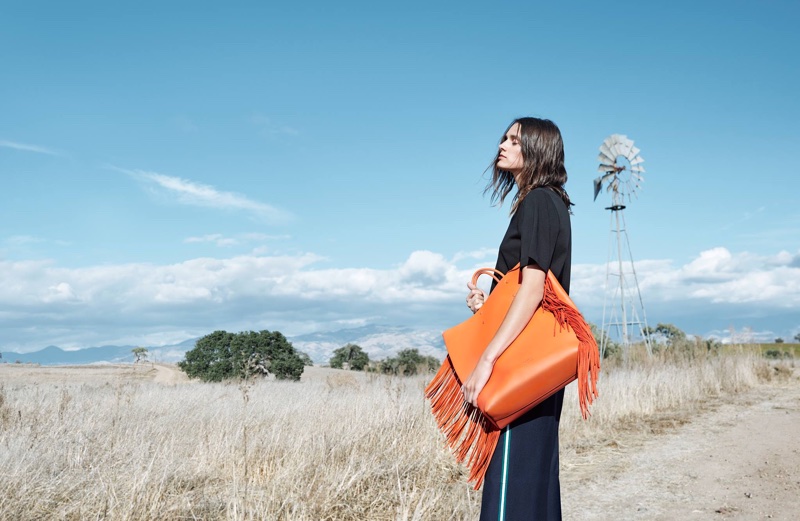 Leila Goldkuhl poses with orange bag in CK Calvin Klein's spring-summer 2018 campaign