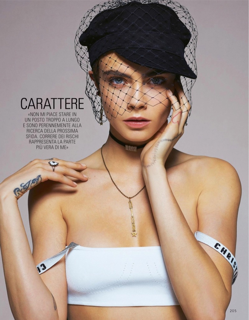 Model Cara Delevingne wears Dior hat, bralette and necklace