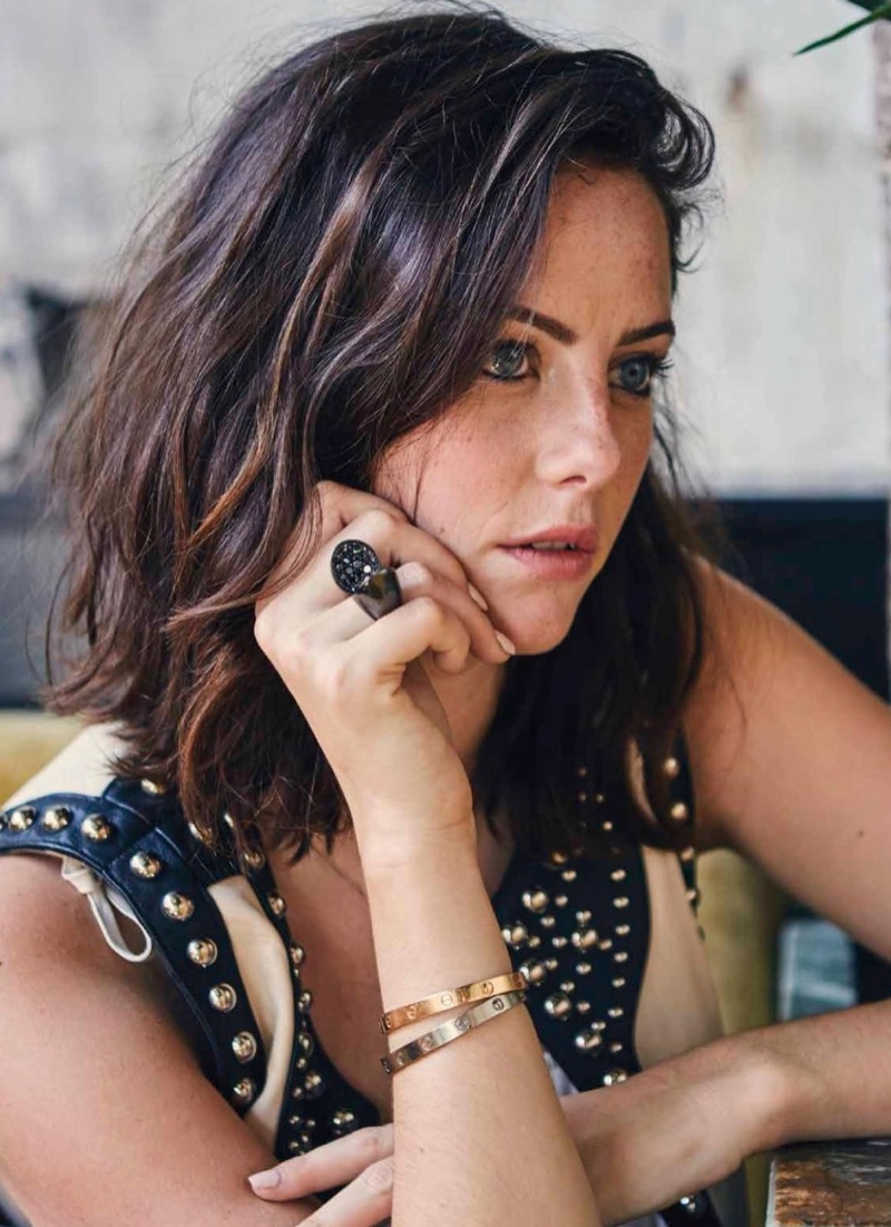 Actress Kaya Scodelario wears Nasty Gal vest and Cartier bracelets