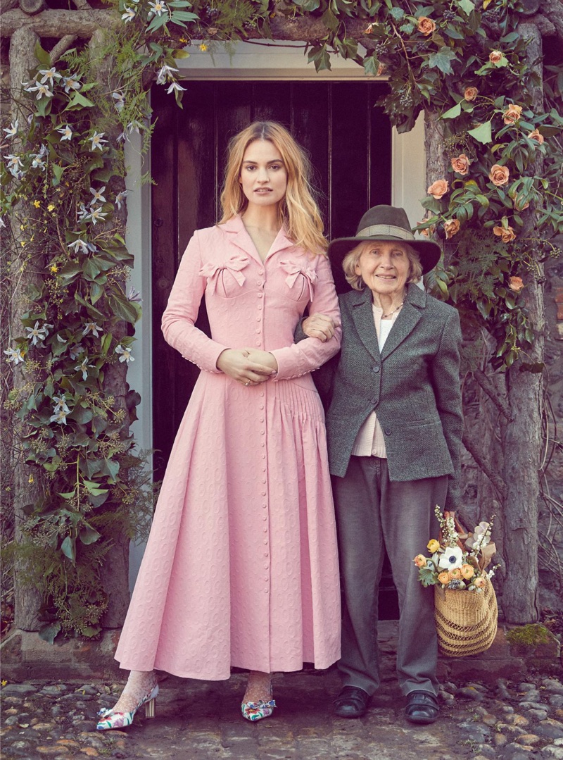 Looking pretty in pink, Lily James wears Emilia Wickstead coat dress and Salvatore Ferragamo heels