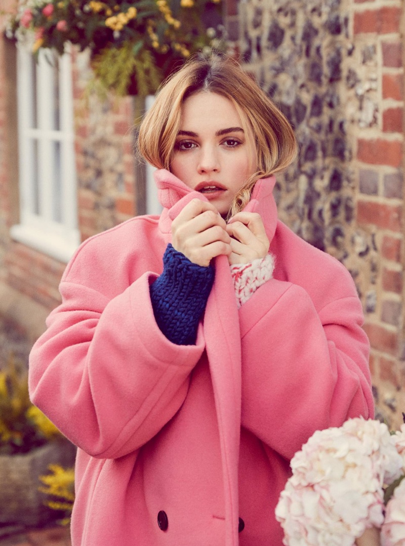 Lily James poses in Burberry wool coat and sweater