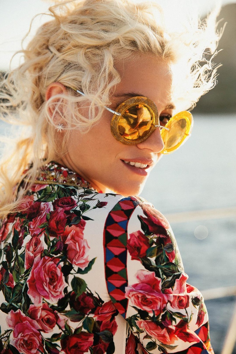 Ready for her closeup, Pixie Lott wears gold sunglasses and floral print shirt