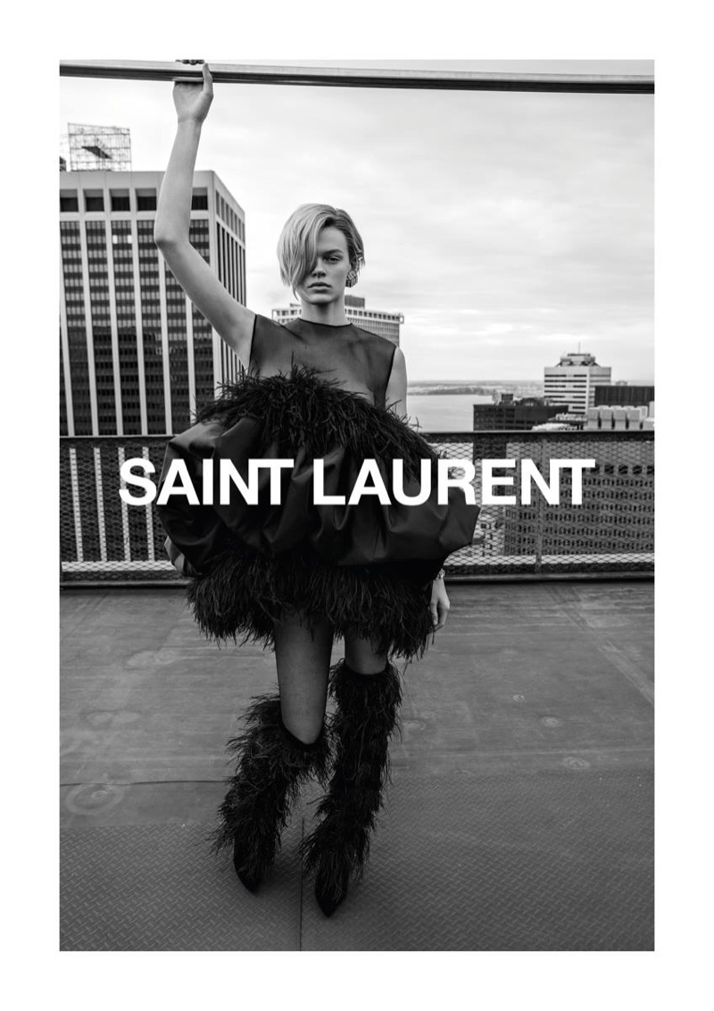 Cara Taylor wears feathered dress and boots for Saint Laurent’s spring-summer 2018 campaign