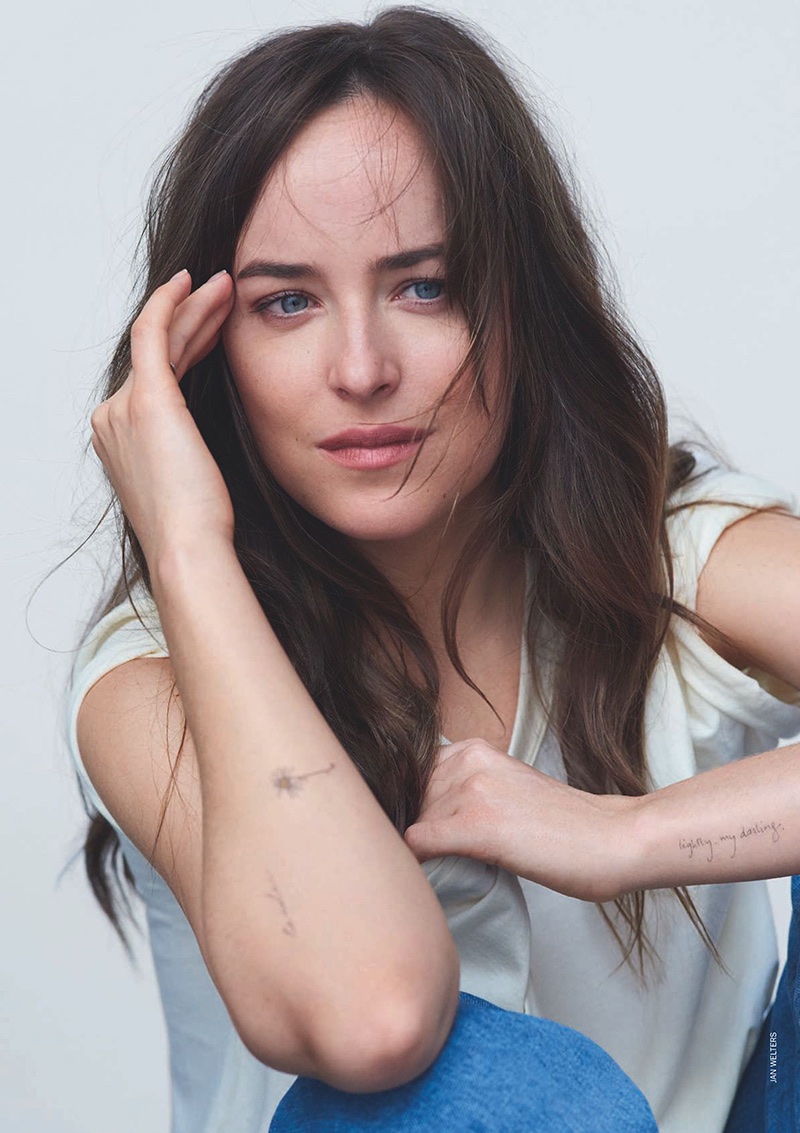 Actress Dakota Johnson shows off her arm tattoos