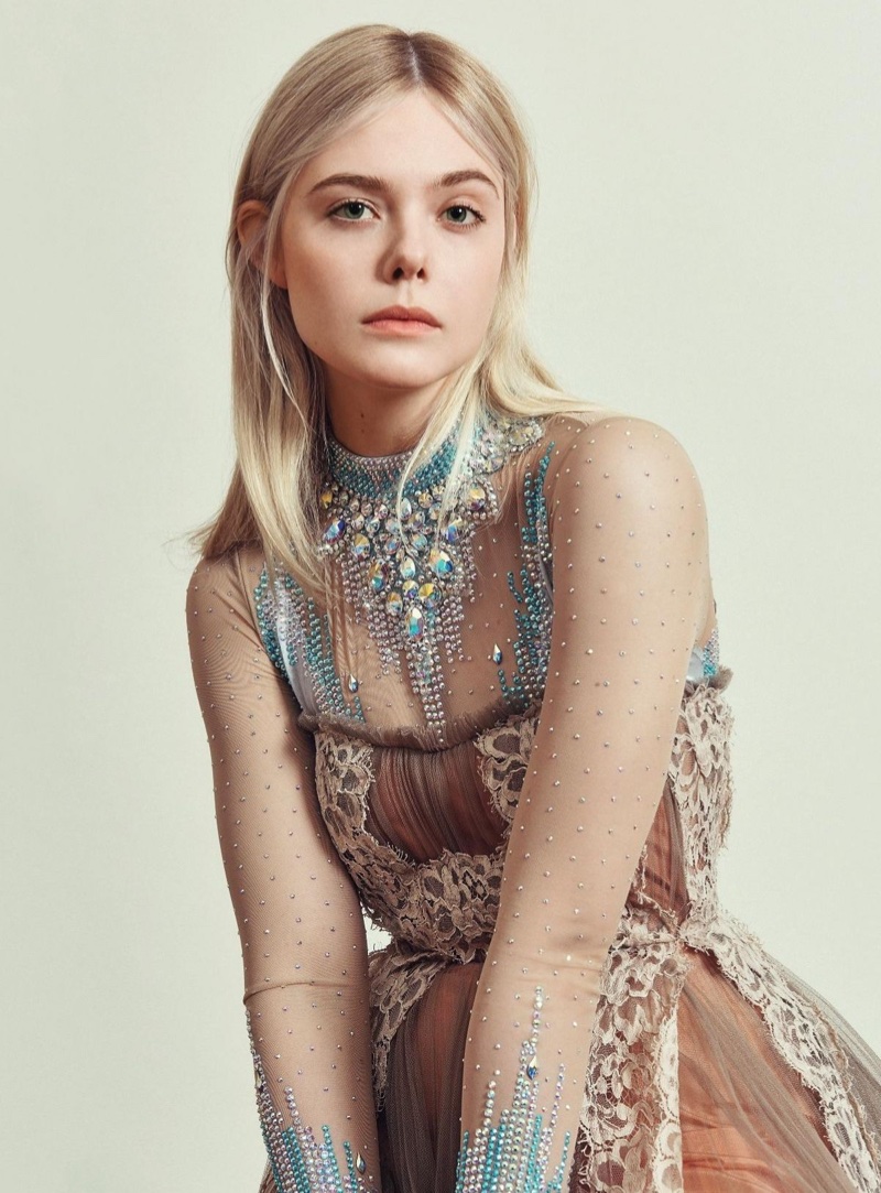 Actress Elle Fanning wears embellished bodysuit and lace dress from Gucci