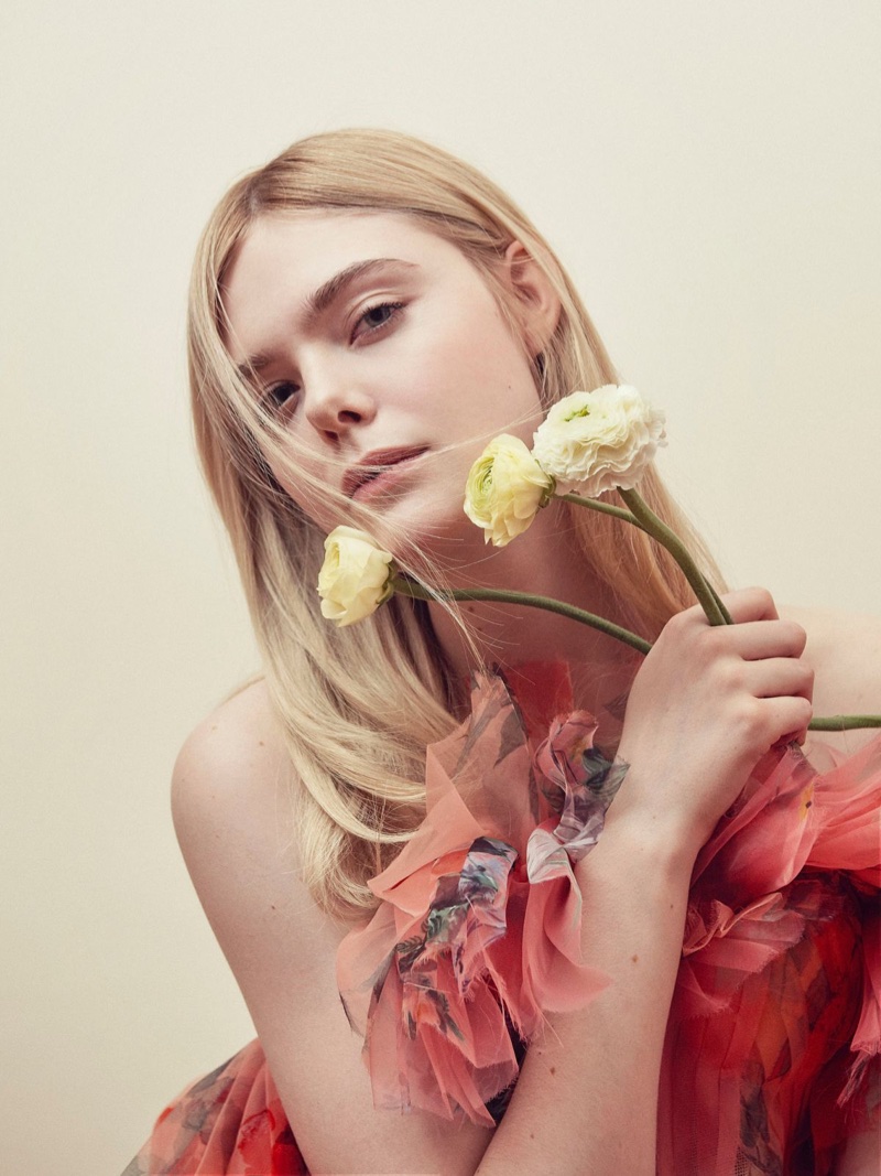 Elle Fanning poses in red Alexander McQueen dress