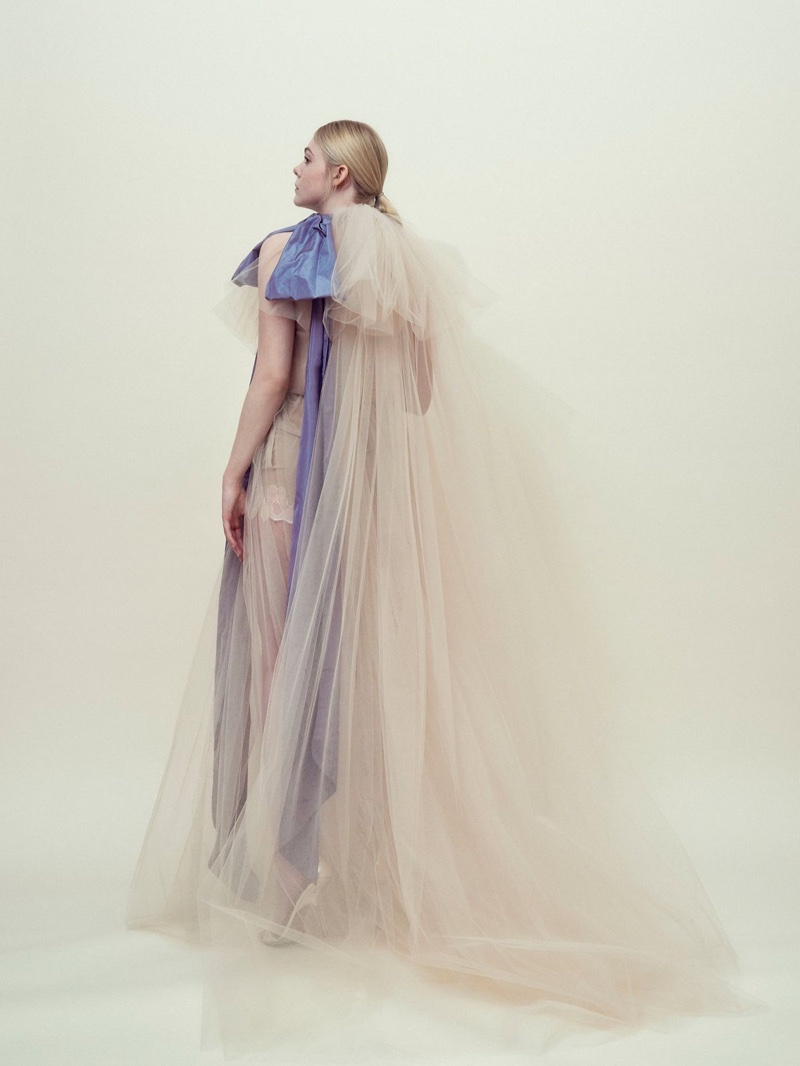 Actress Elle Fanning wears a tulle gown from Valentino Haute Couture