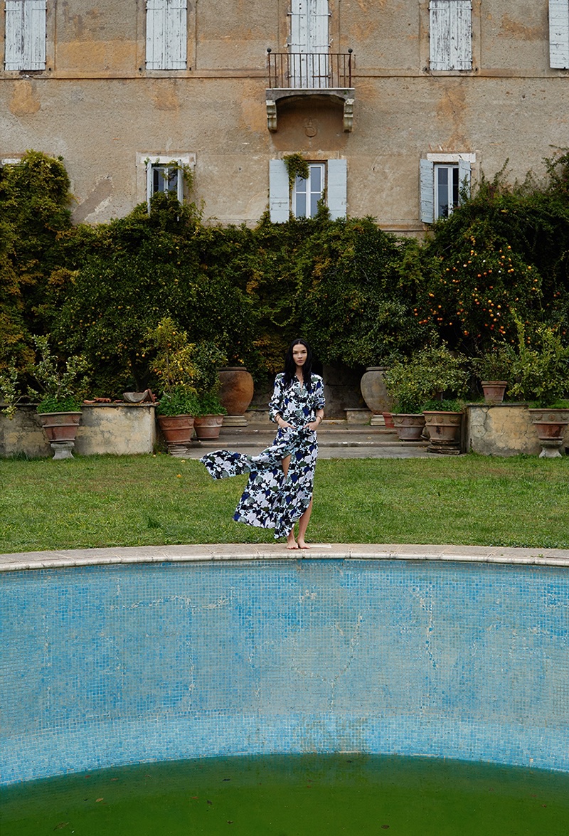 Model Mariacarla Boscono poses by a pool in Equipment's spring-summer 2018 campaign