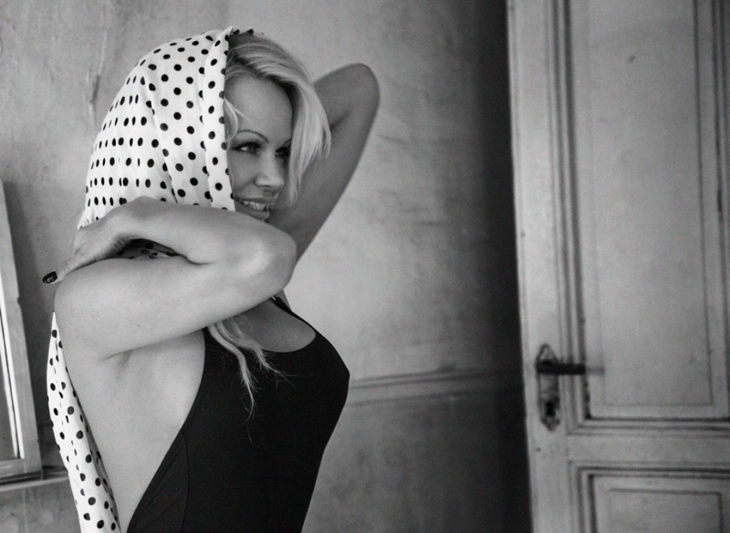 Actress Pamela Anderson wears polka dot print scarf and bodysuit