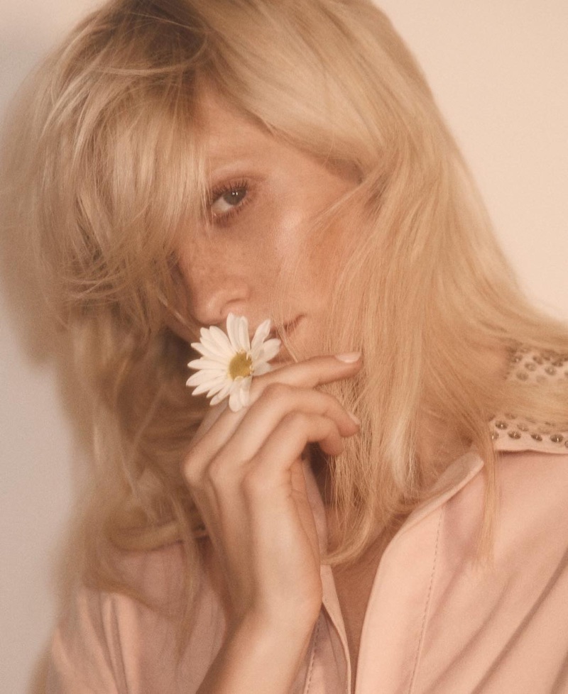 Poppy Delevingne poses with flower