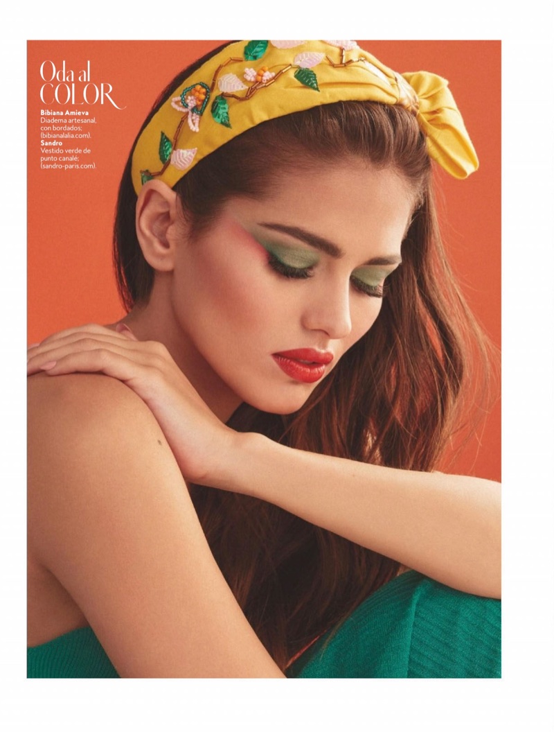 Showing off green eyeshadow and red lipstick, Sara Sálamo stuns in this shot