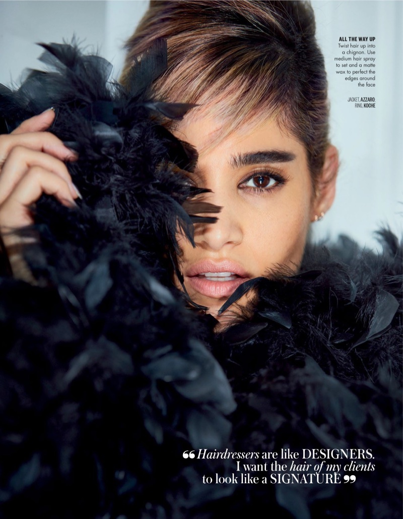 Dressed in feathers, Sofia Boutella poses in Azzaro jacket