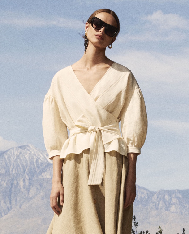 Birgit Kos wears Zara textured wrap top, buttoned linen skirt and square sunglasses