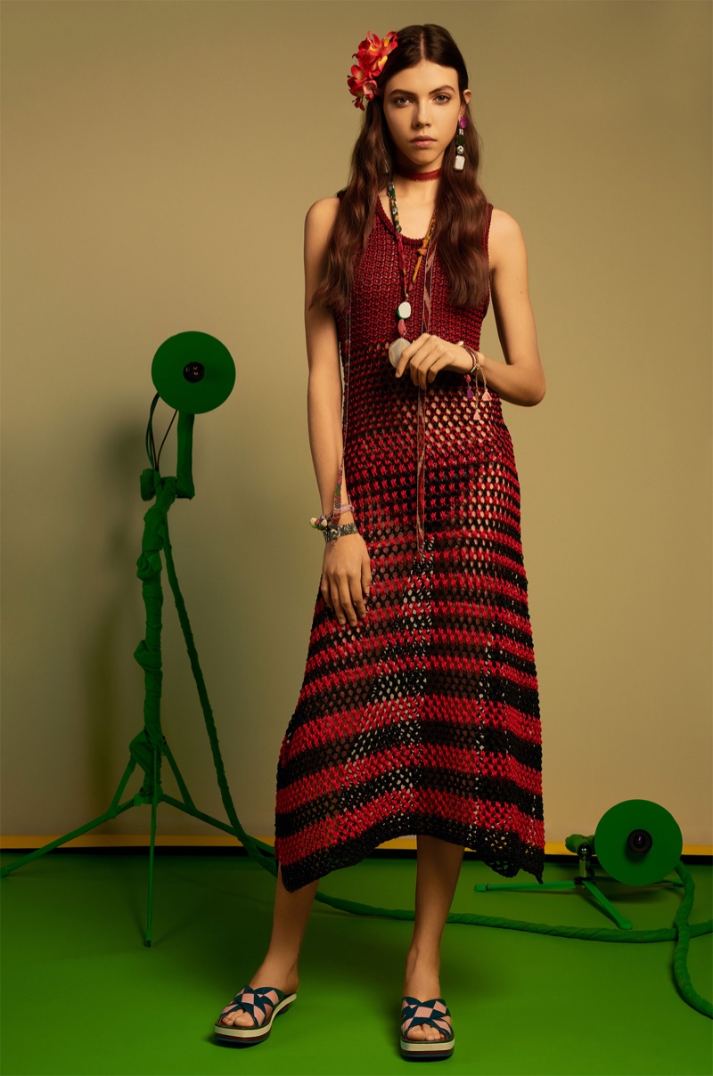 Léa Julian models Zara long striped dress and leather slides with geometric detail