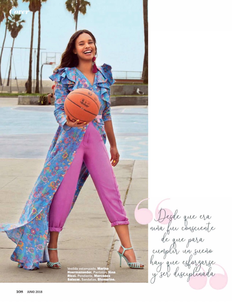 Holding a basketball, Alisha Boe poses in Marina Hoermanseder dress, Nina Ricci pants and Blumarine heels