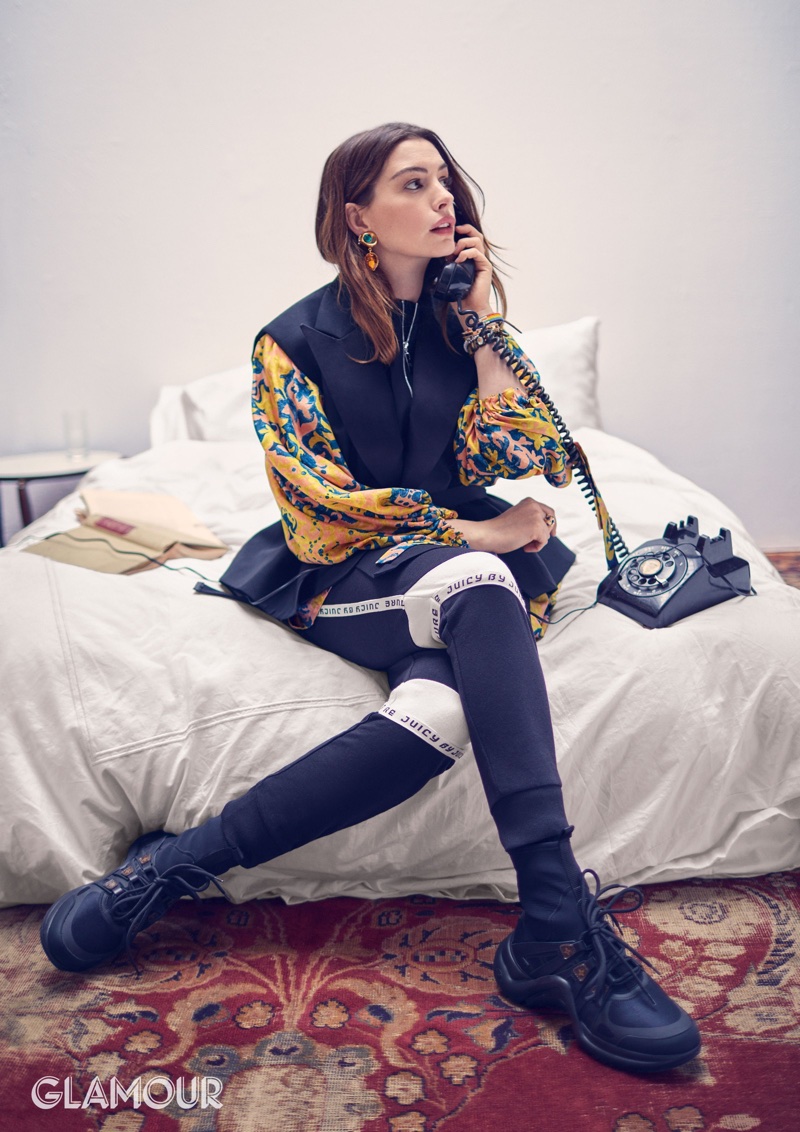 Anne Hathaway wears Louis Vuitton jacket, dress and shoes with Juicy by Juicy Couture pants