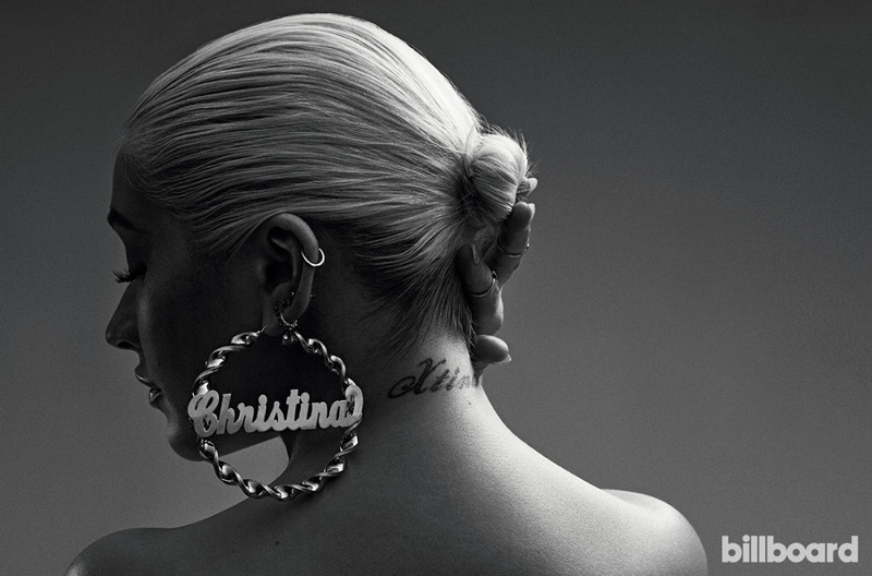 Christina Aguilera wears custom large hoop earrings with her name