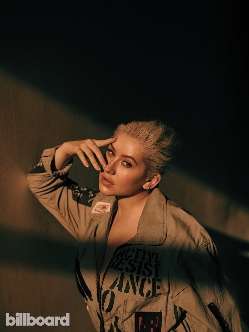 Striking a pose, Christina Aguilera wears khaki jacket
