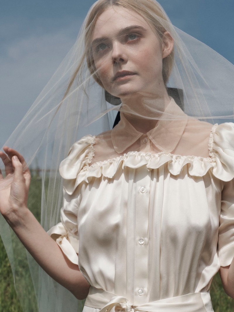 Covering up, Elle Fanning poses in Simone Rocha dress and Jennifer Behr hair clip