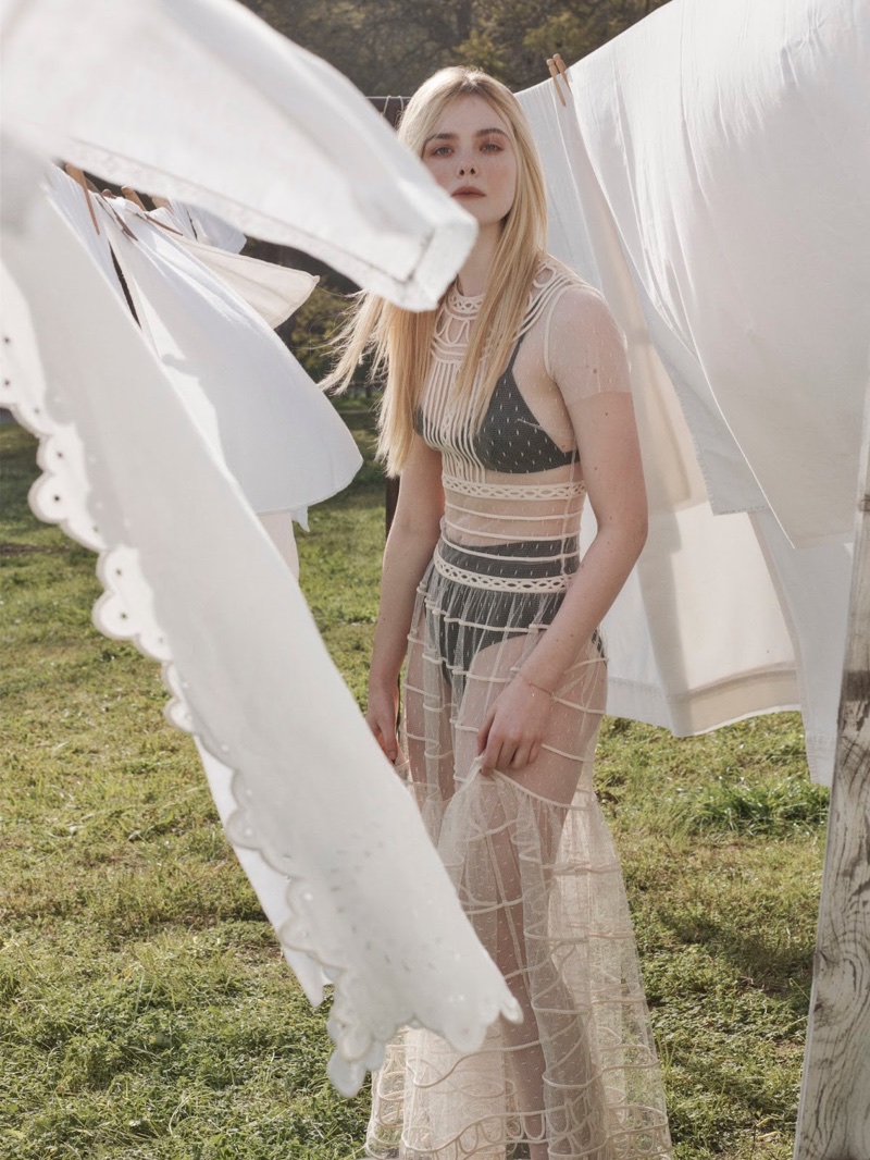 Posing outdoors, Elle Fanning wears RED Valentino gown