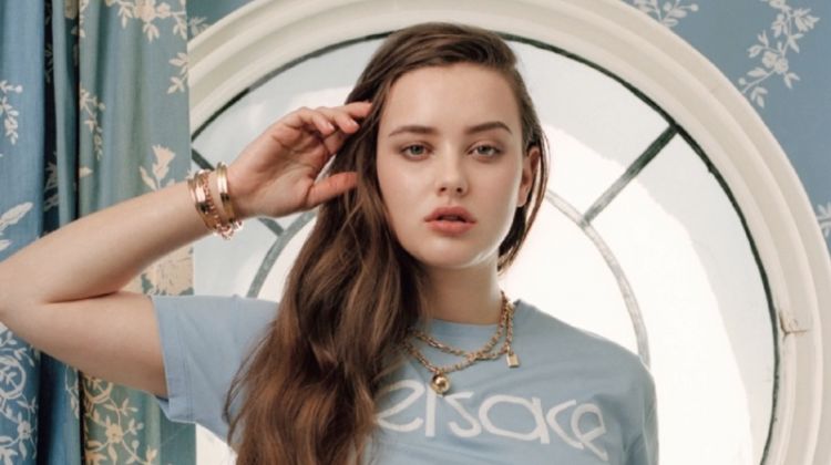 Actress Katherine Langford wears Versace t-shirt and jeans with Tiffany & Co. jewelry