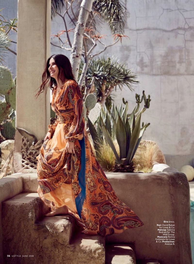 Flashing a smile, Sandra Bullock poses in Etro dress