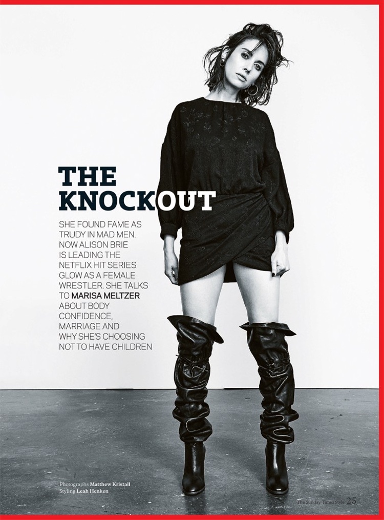 Actress Alison Brie wears Saint Laurent minidress and boots