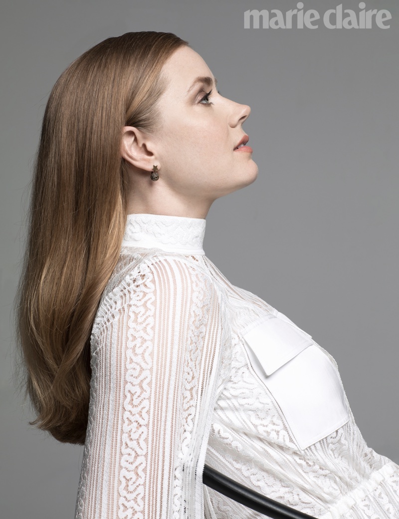 Amy Adams poses in white lace ensemble