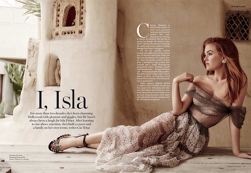 Actress Isla Fisher poses in Dior dress with Aquazzura sandals and Tiffany & Co. earrings
